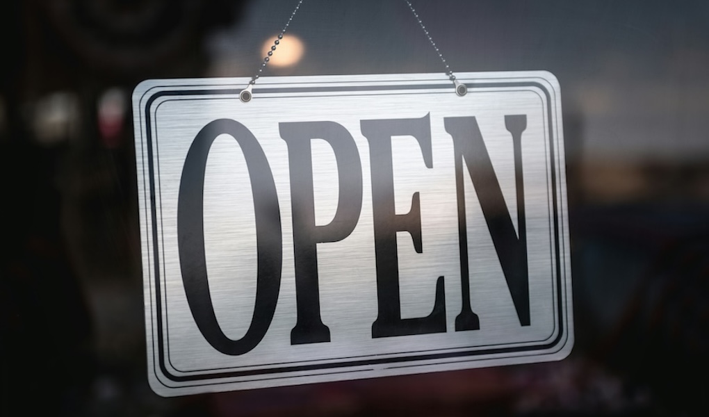 A hanging sign displaying the word OPEN.